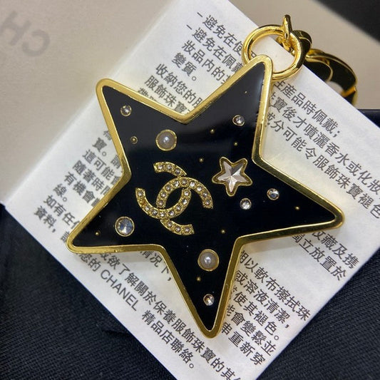 18K Chanel Black Gold Star Brooch